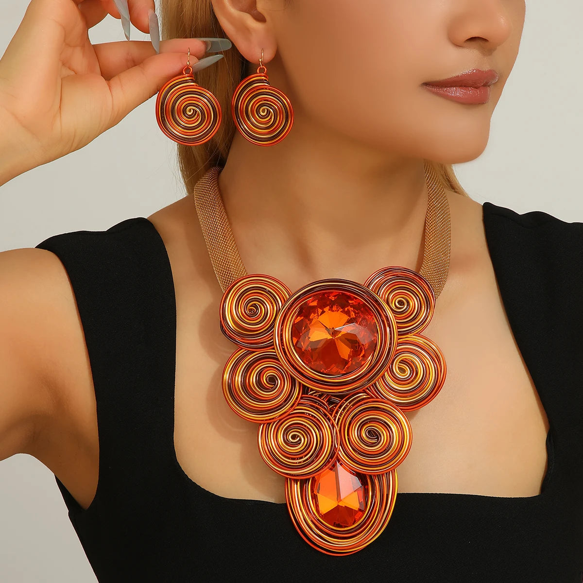 A set of new yellow jewelry, exaggerated design, teardrop crystal gemstone, aluminum wire woven large necklace and earrings